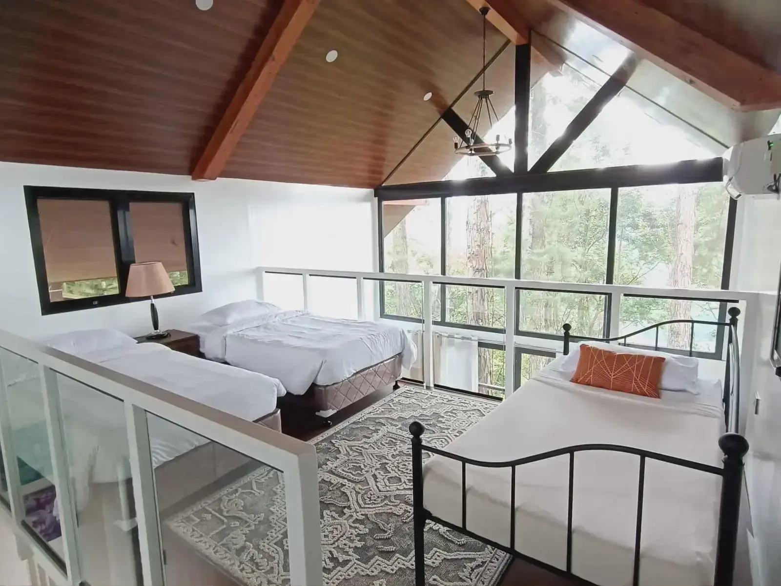 King Fisher Cabin upper level with single beds and pine views